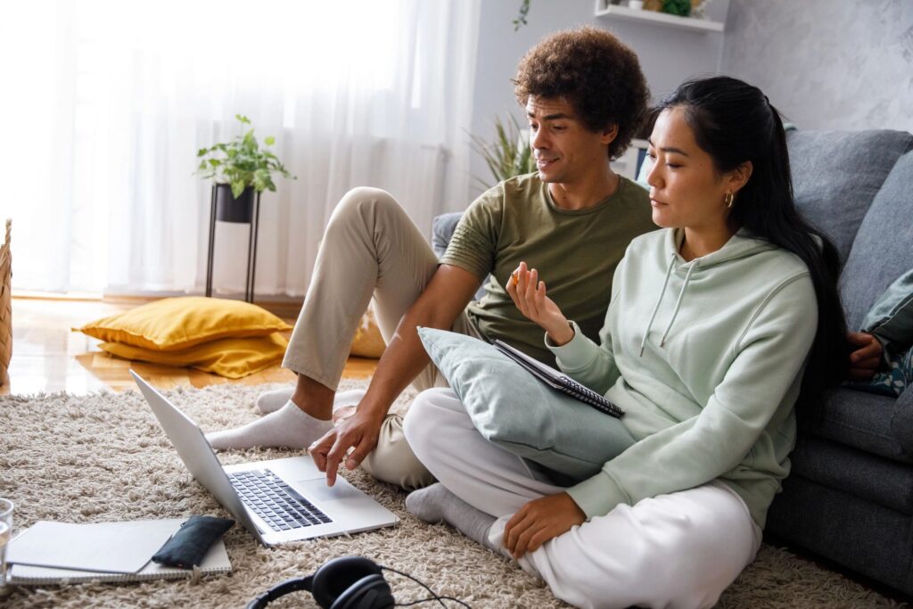 Couple watching a video on investing in stock market and having discussions