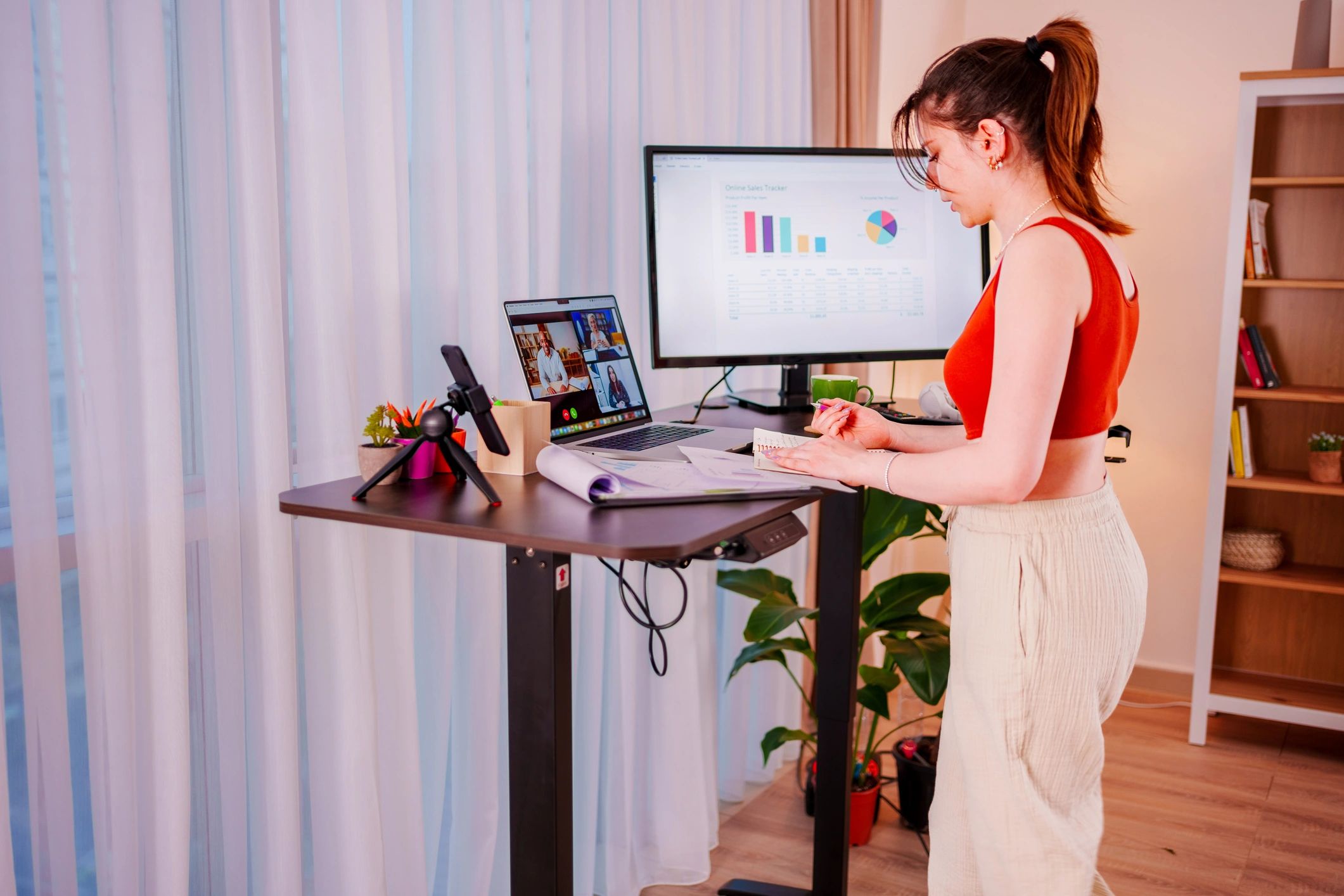 Professional reviewing market charts on a laptop
