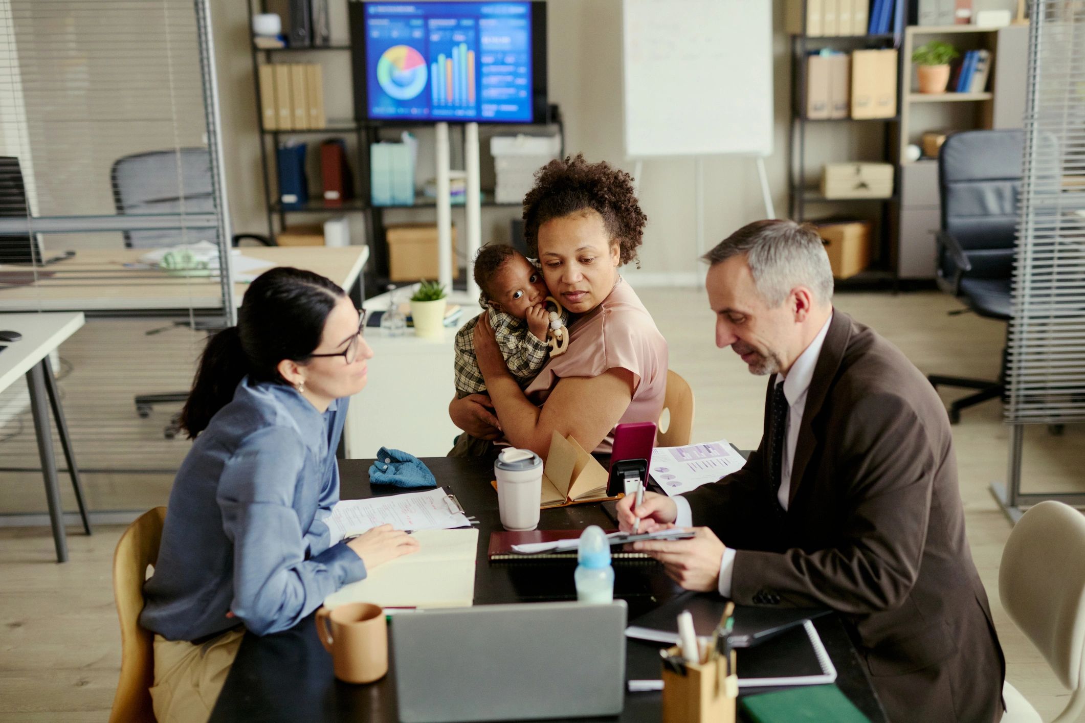 Adults participating in a financial education meeting