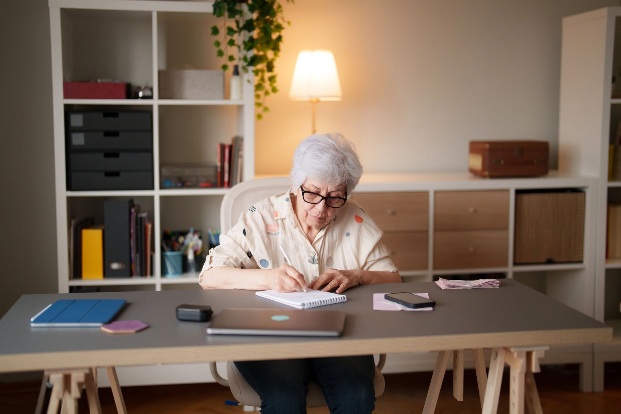 Personal finance and retirement planning at a home office desk